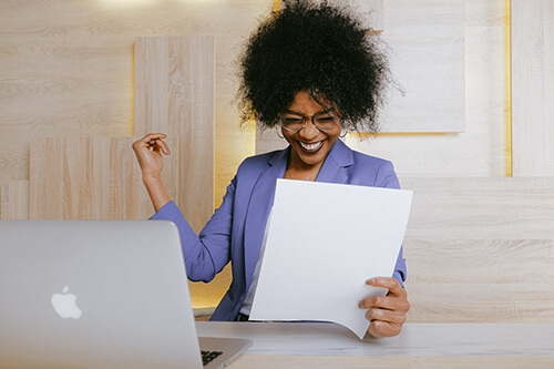 Woman Smiling At Letter